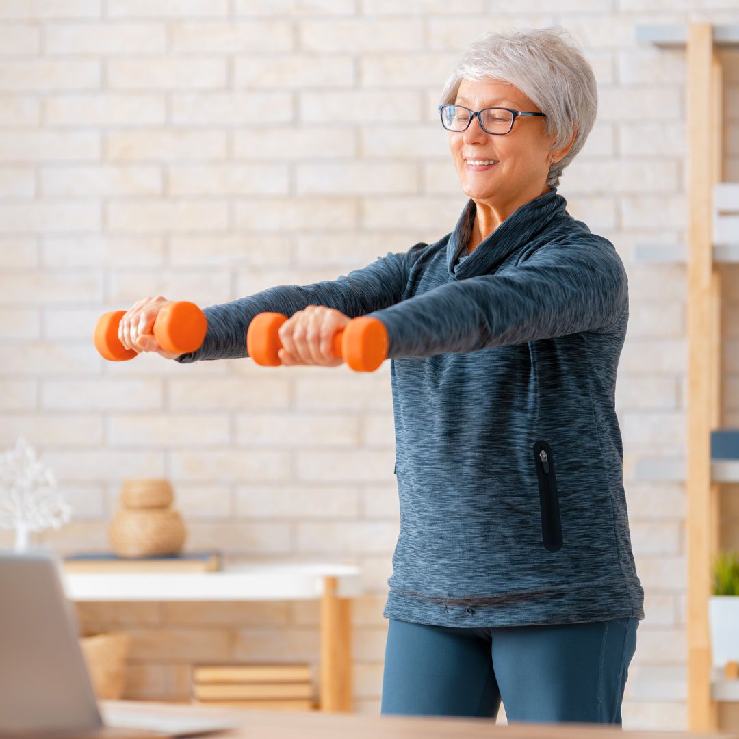 Image of senior lady exercising at home.