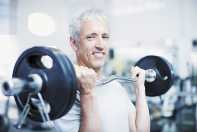 Image of an older adult male performing strength and resistance training.