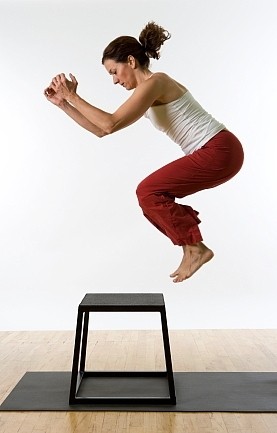 Image of female client doing a plyometric move.