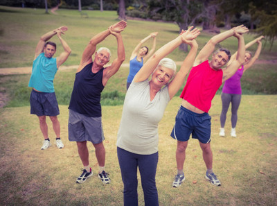 Image of seniors enjoying their group exercise outdoors.