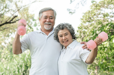 Image of a fit-looking senior couple utilizing their fitness offer.