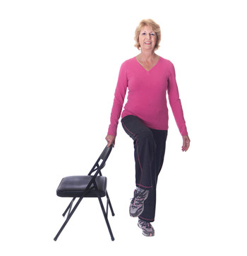 Image of a older female doing balance exercises.