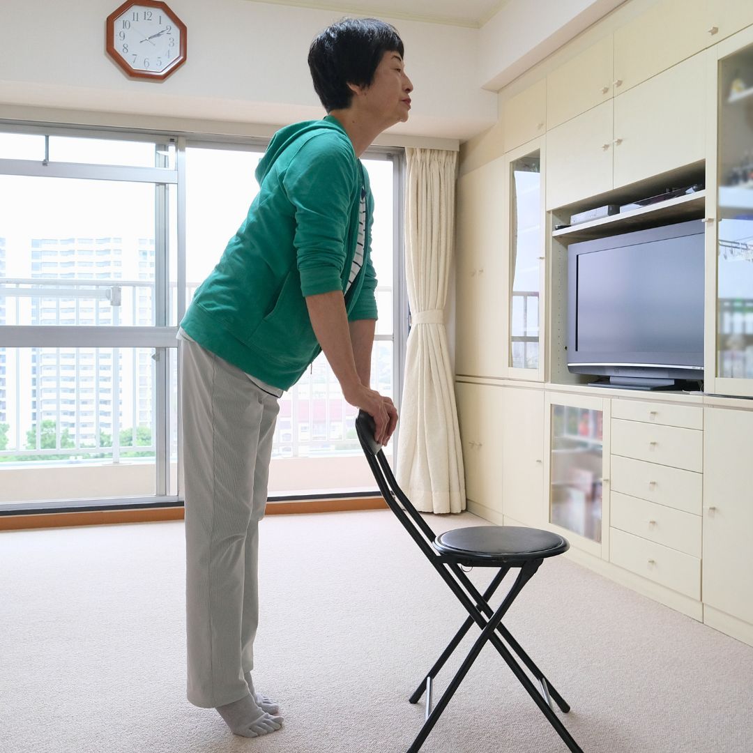 Image of senior woman exercising while on a travel vacation.