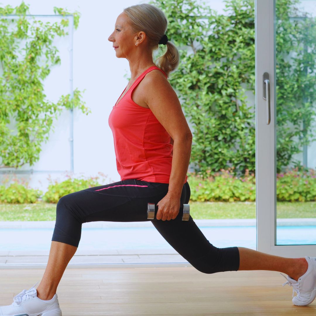 Image of senior woman performing weight-bearing exercises.