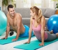 Photo of a couple engaged in partner fitness training.