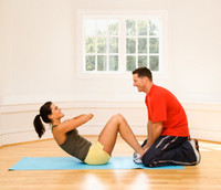 Picture of a personal training client with her personal trainer.
