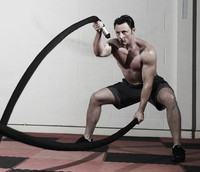 Image of a trainer performing integrated fitness workouts.