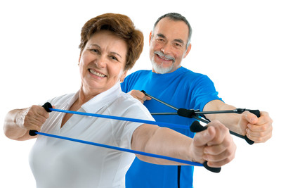 Picture of a senior couple exercising with resistance tubings.