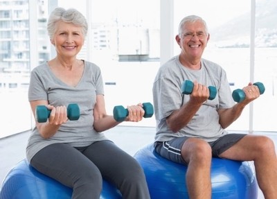Image of 2 older adults enjoying their senior fitness training program.